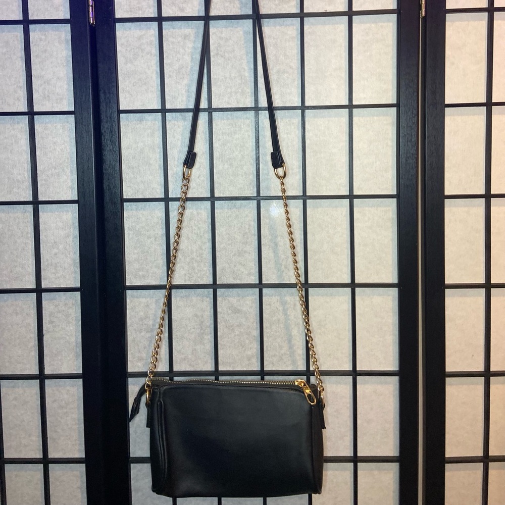 Black purse with gold chain